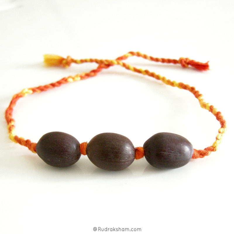 Wholesale Pack of 10 - Lotus Seed Beads and Moli Band | Black Kamal Gatta Beads Band with Mauli Thread ( Kalawa ) | Sacred Hindu Pooja Thread with Lotus Beads to make a Wrist Bracelet